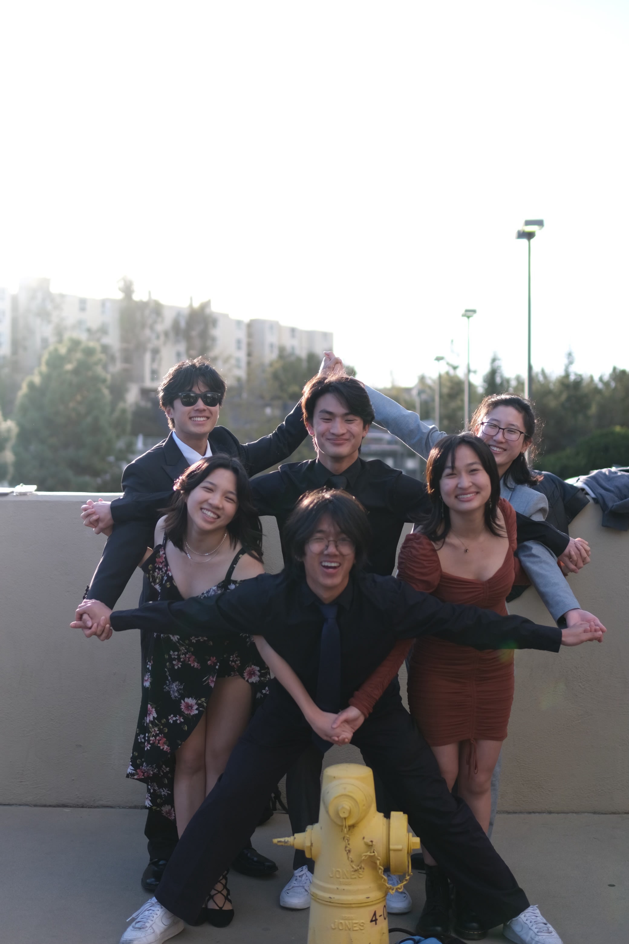 UCLA Dragon Boat members forming a star