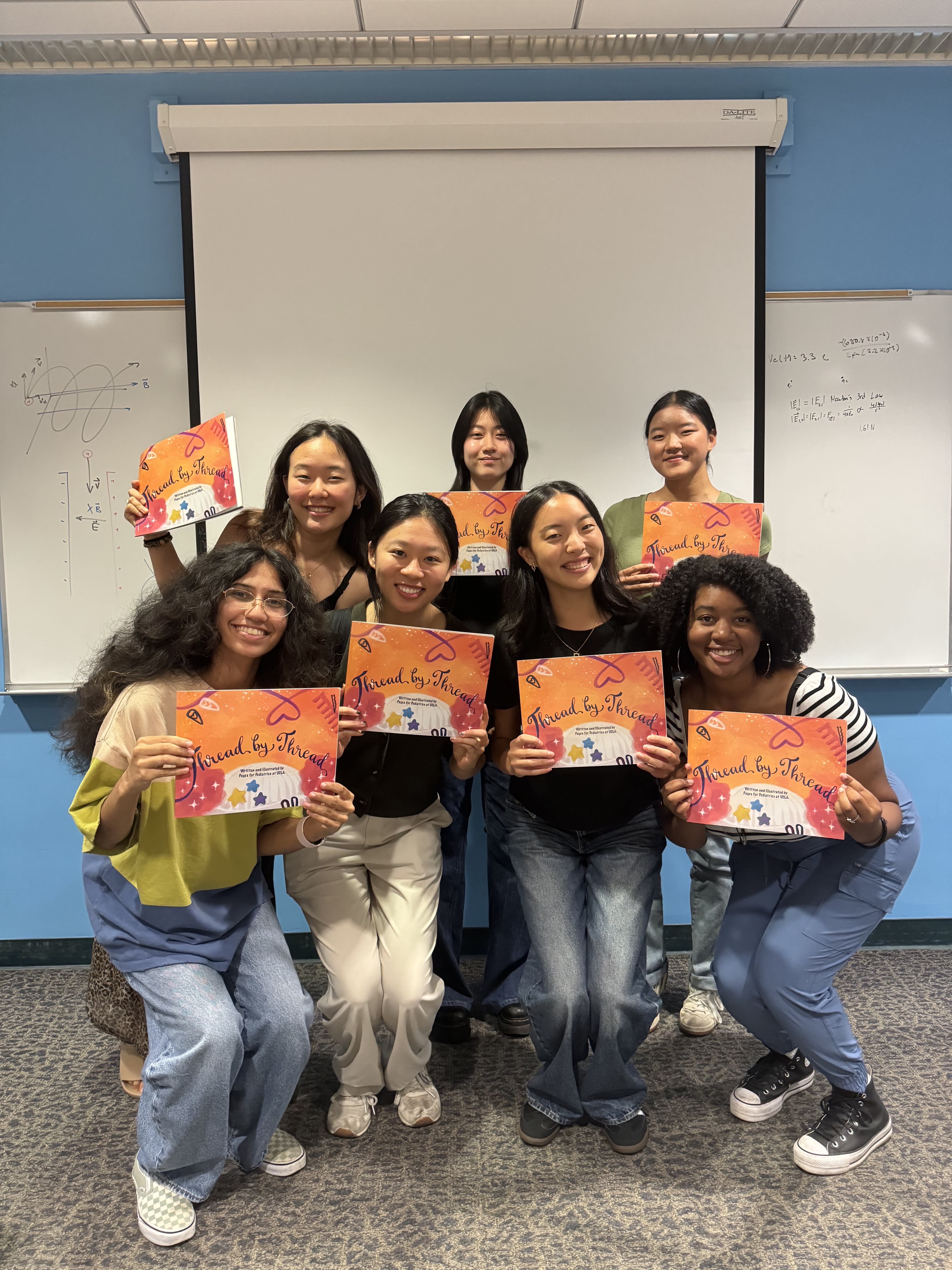 Members of PFP @ UCLA holding copies of our book!