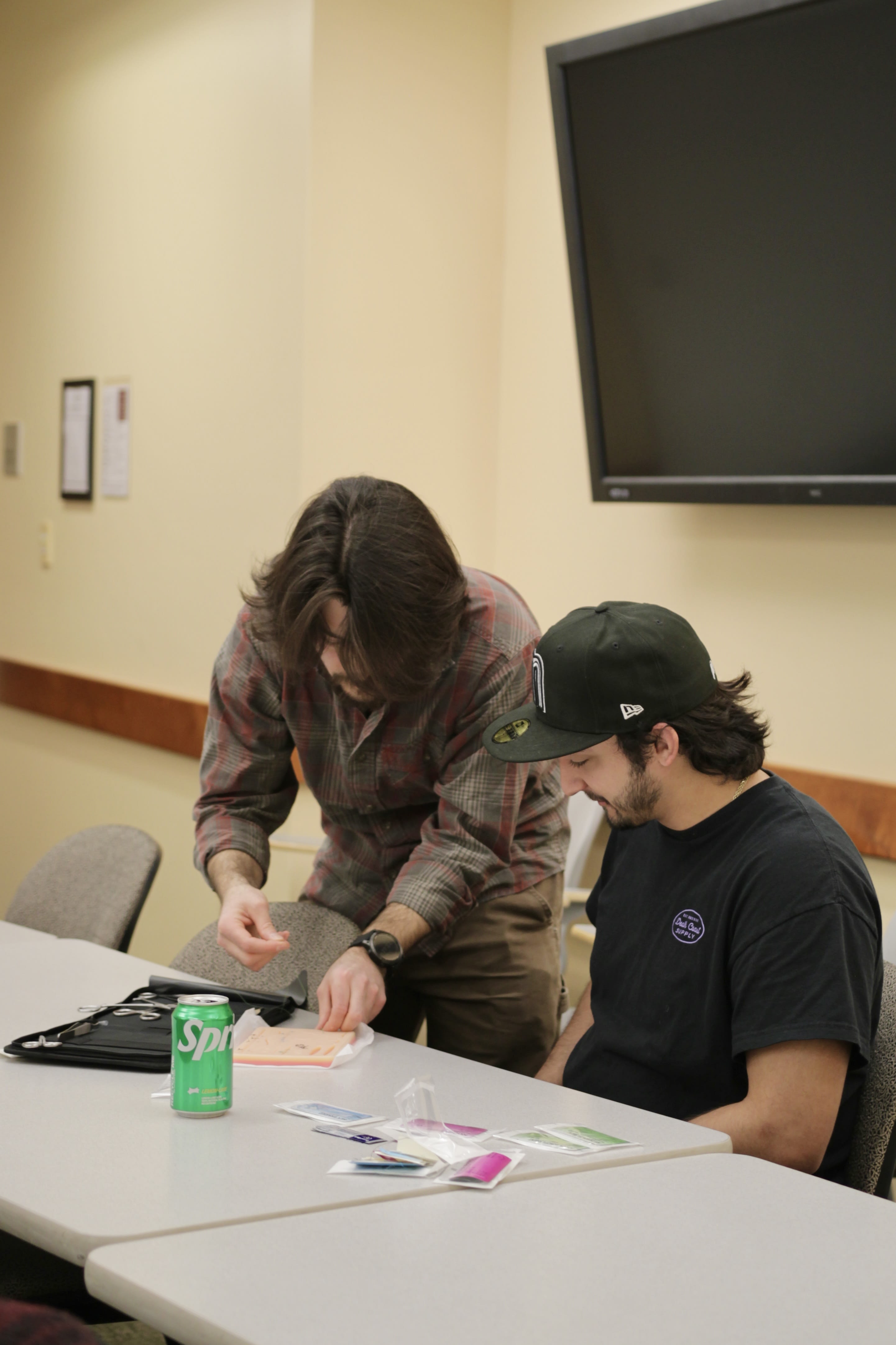 Josh Holloway, PA-C, assisting a student