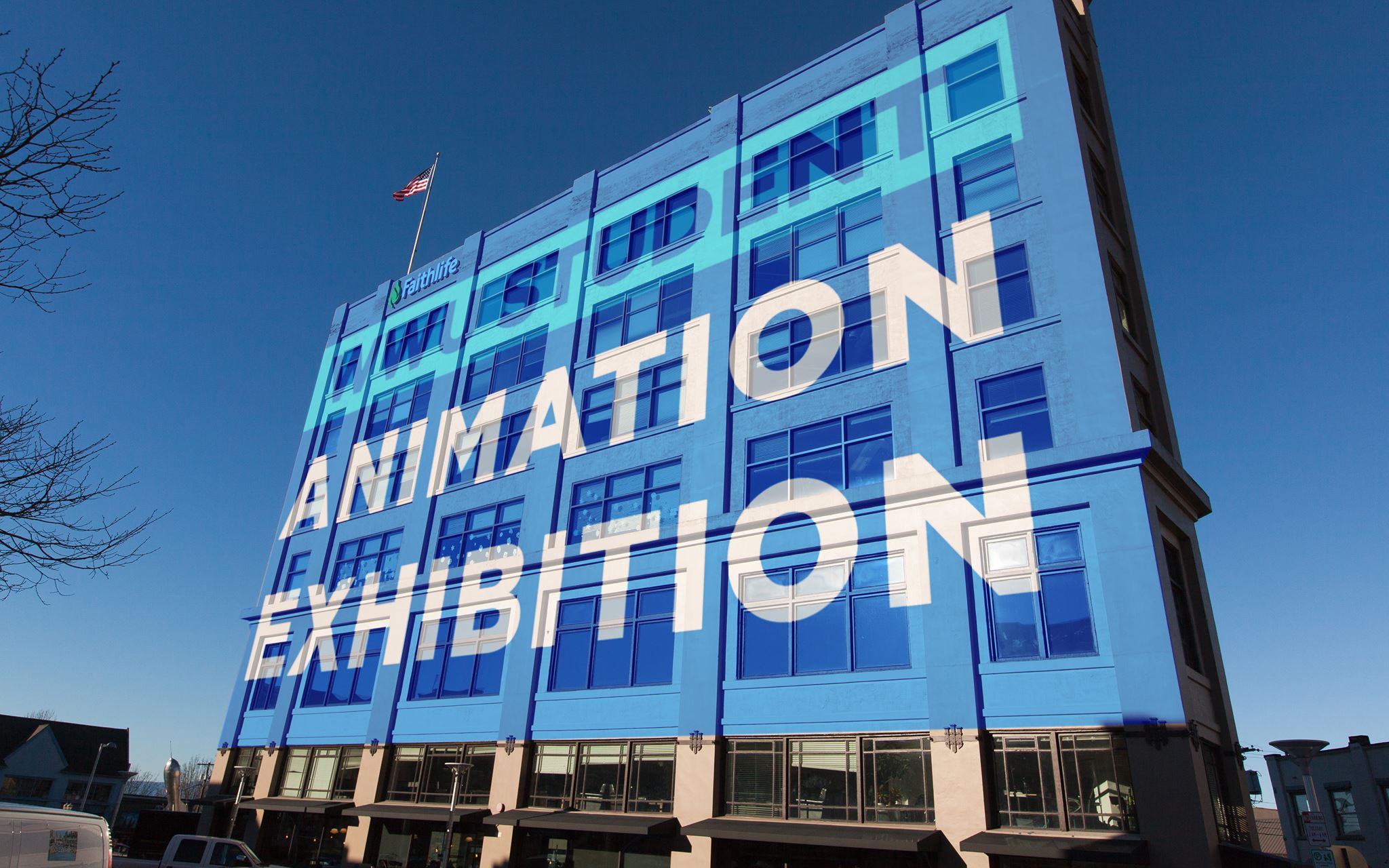 projection of the words "Animation Exhibition" on the side of a 5-story building