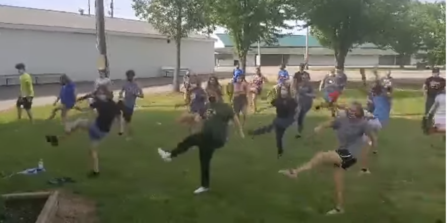 Kids dancing together at 4-H camp.