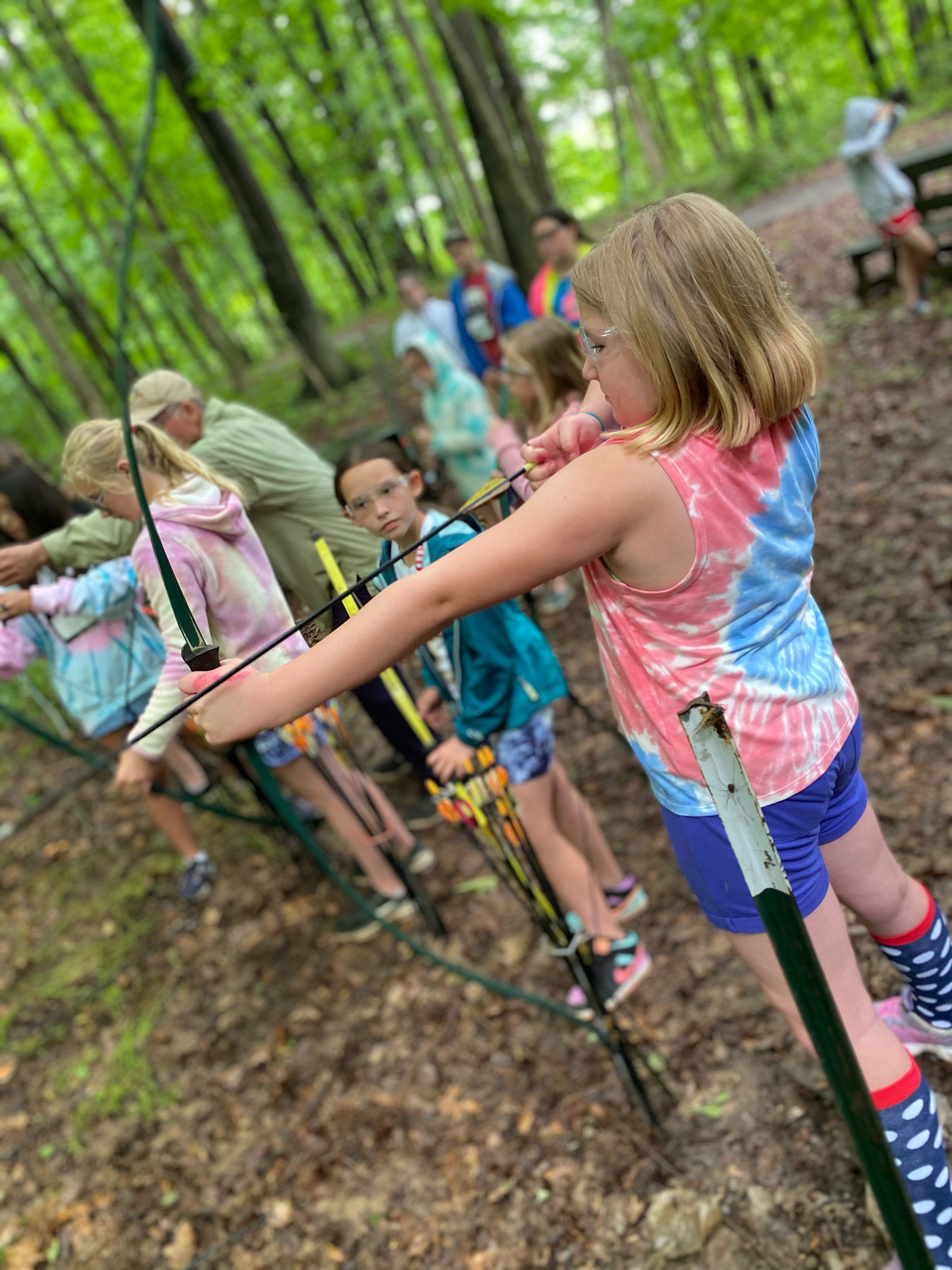 Kids doing archery during Ohio 4-H camp.