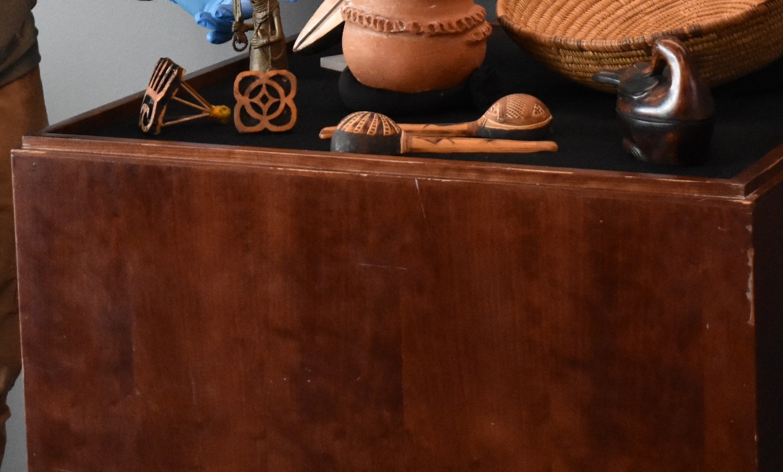 A table with a variety of objects on it
Description automatically generated