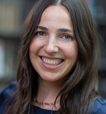 A professional headshot of Mara Frazier