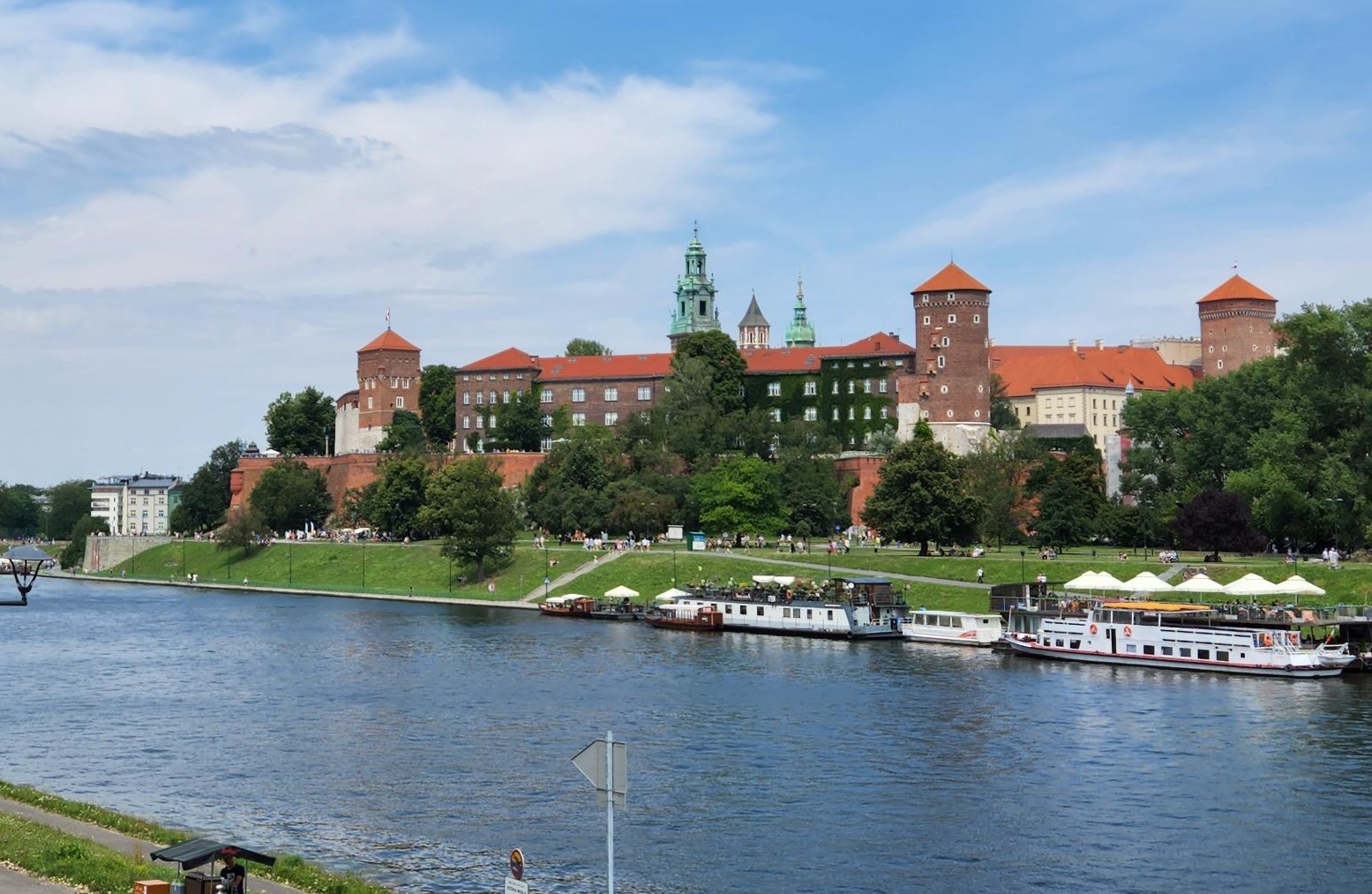 Wawel Castle with the view of river and boats. The picture had been taken from the opposite side of the river 
