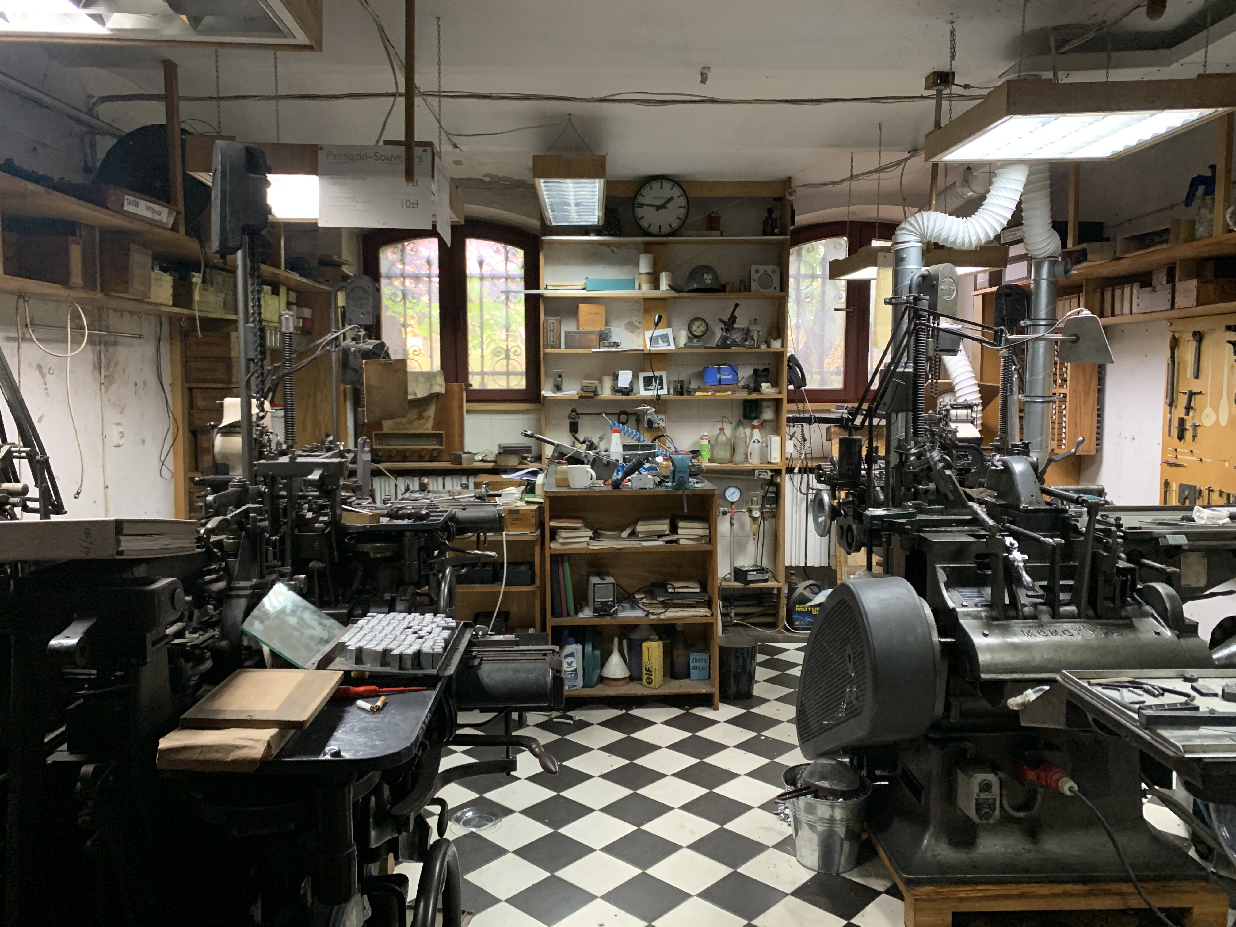 An old fashioned printing press and workspace