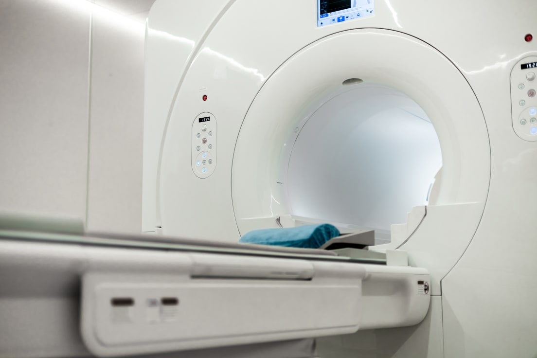 A modern MRI scanner in a hospital suite.