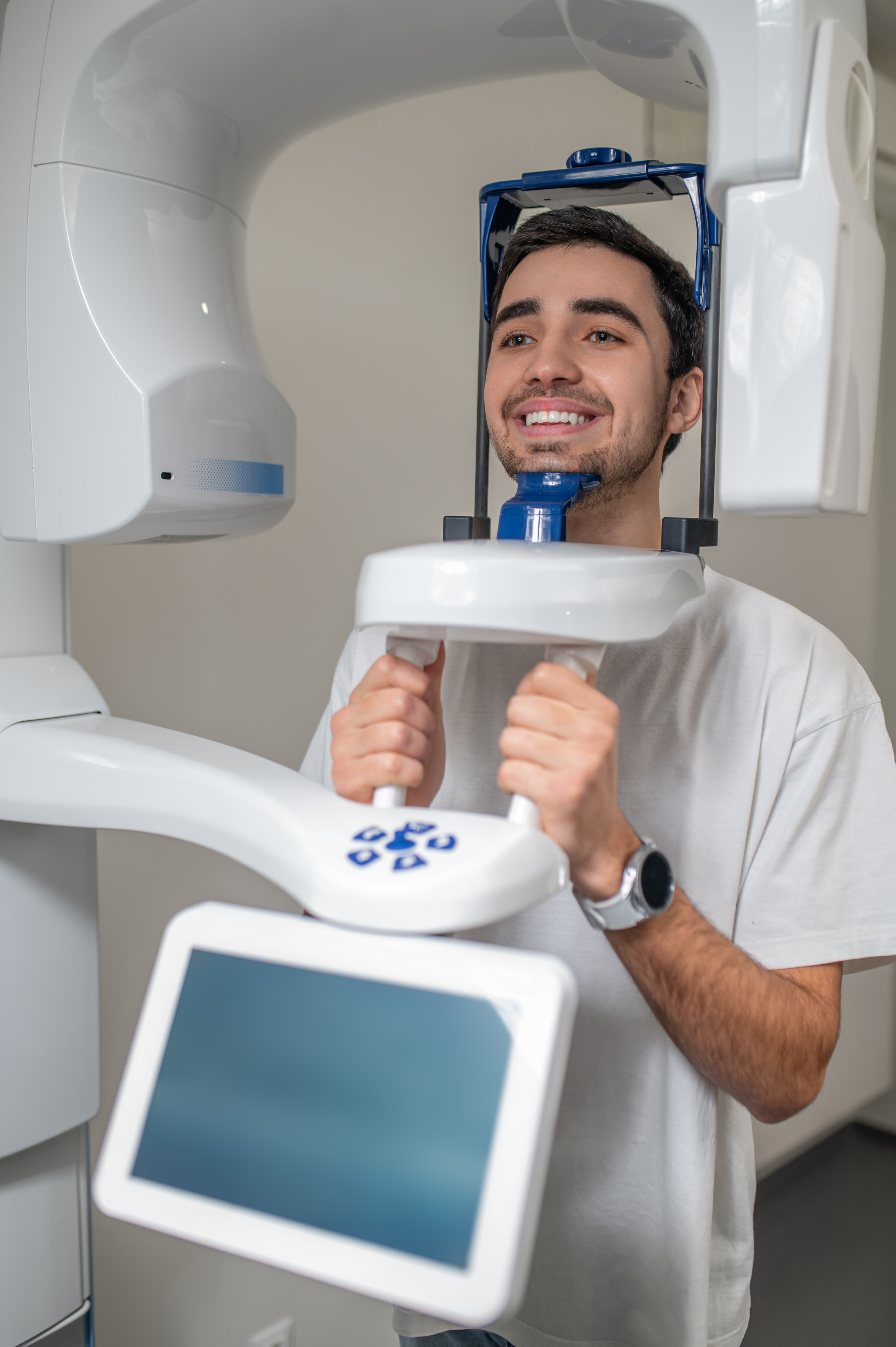Male patient having a dental cone beam CT scan.