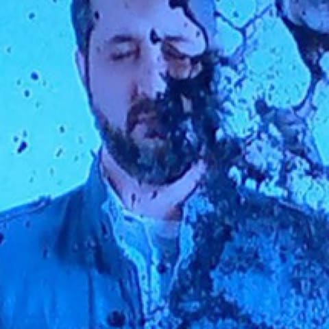 man getting splashed by paint