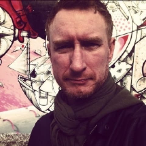 man squinting in a selfie