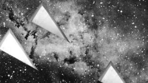 Wedges are overlaid on a photograph of a galaxy. The picture is grainy and grayscale.