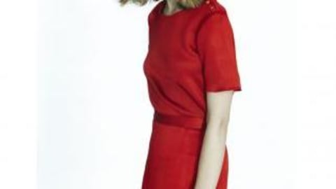 A woman wearing a red dress.