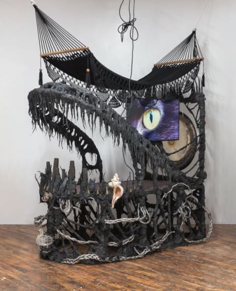 A photograph of a large mixed-media sculpture.