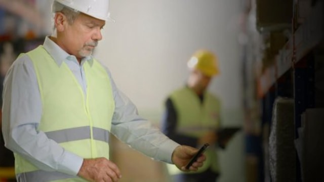worker looking on his smartphone