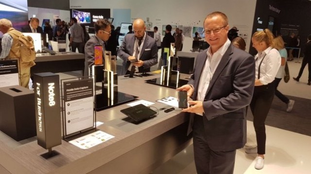 smiling man presenting product