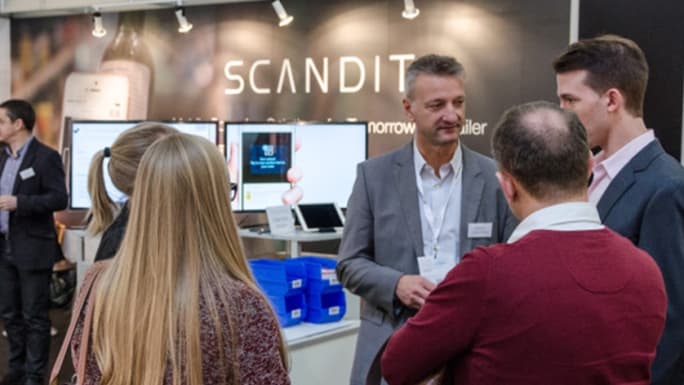 people talking at scandit stall