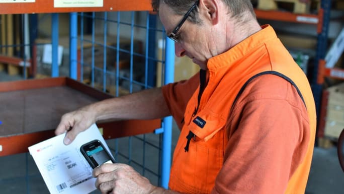 man scanning bill