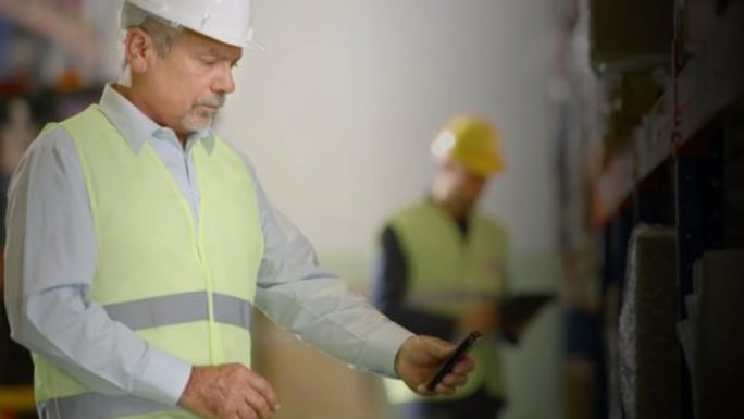worker looking on his smartphone