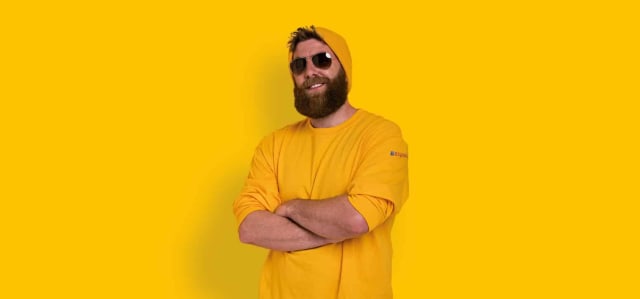 smiling man dressed in yellow