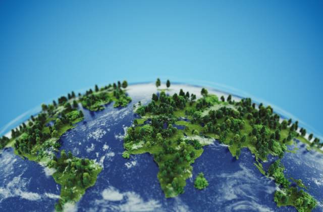 Conceptual green earth with grass and trees