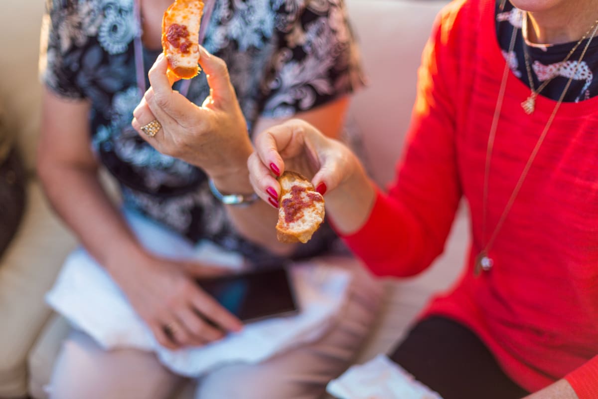 ladies holding traditional sobrasada tapas