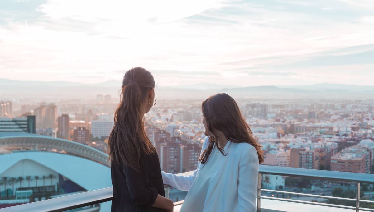 girls watching sunset over opera