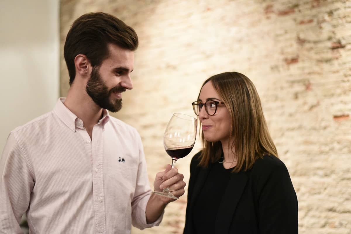 couple enjoying wine tasting in historic venue