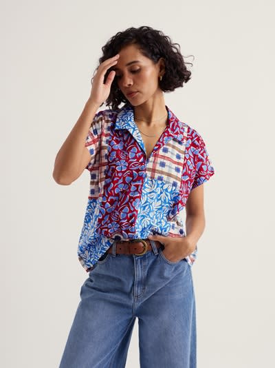 Model wearing patchwork Deep Lane Top in red and blue fabrics checks and floral print from SS25 end-of-roll designs