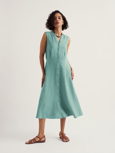 A model wearing our Sleeveless Carved Wood Dress in Sardine, a stunning blue.