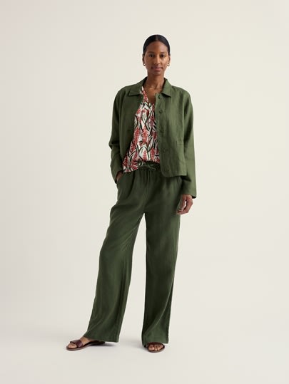 A model wearing our Barnoon Top and a green matching blazer and trouser.