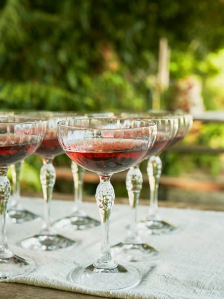 A close up of drinks glasses on a table.