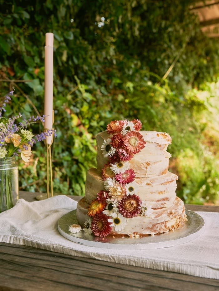 A tiered cake with flowers.