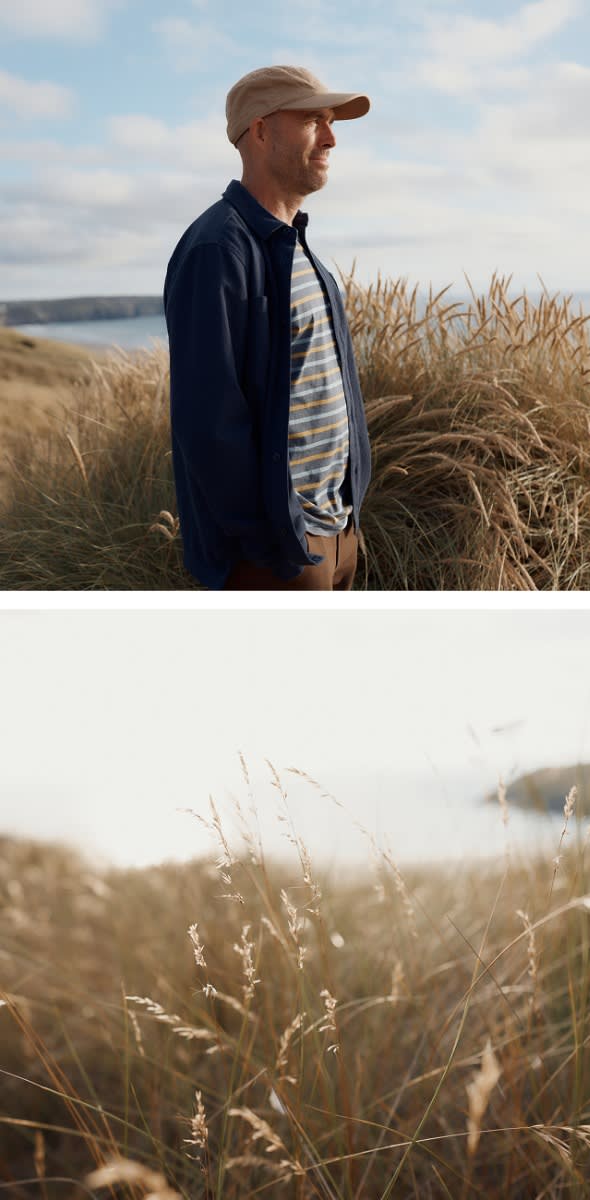 A close up of Jon Cripps, a ranger for the Cornwall Wildlife Trust, standing next to windswept dune grass on a Cornish sand dune