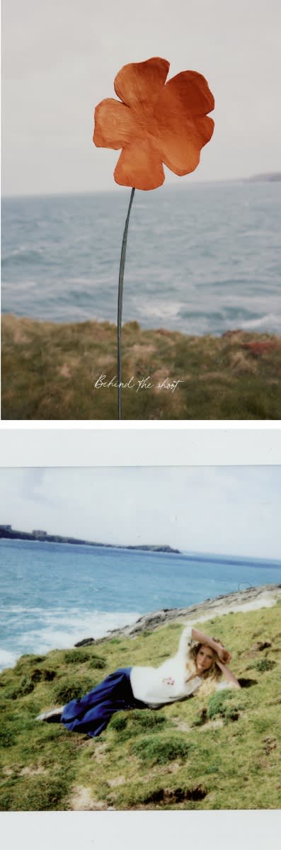 An image of a large floral prop next to an imagine of a polaroid of a woman on a cliff top wearing Seasalt