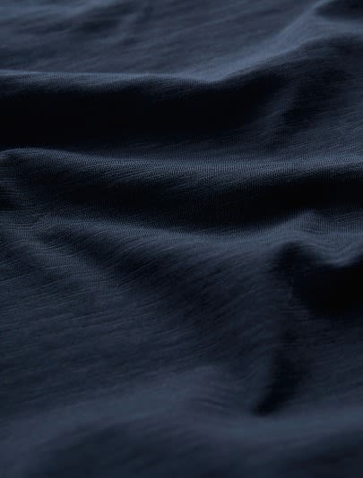A close up of some navy blue jersey cotton