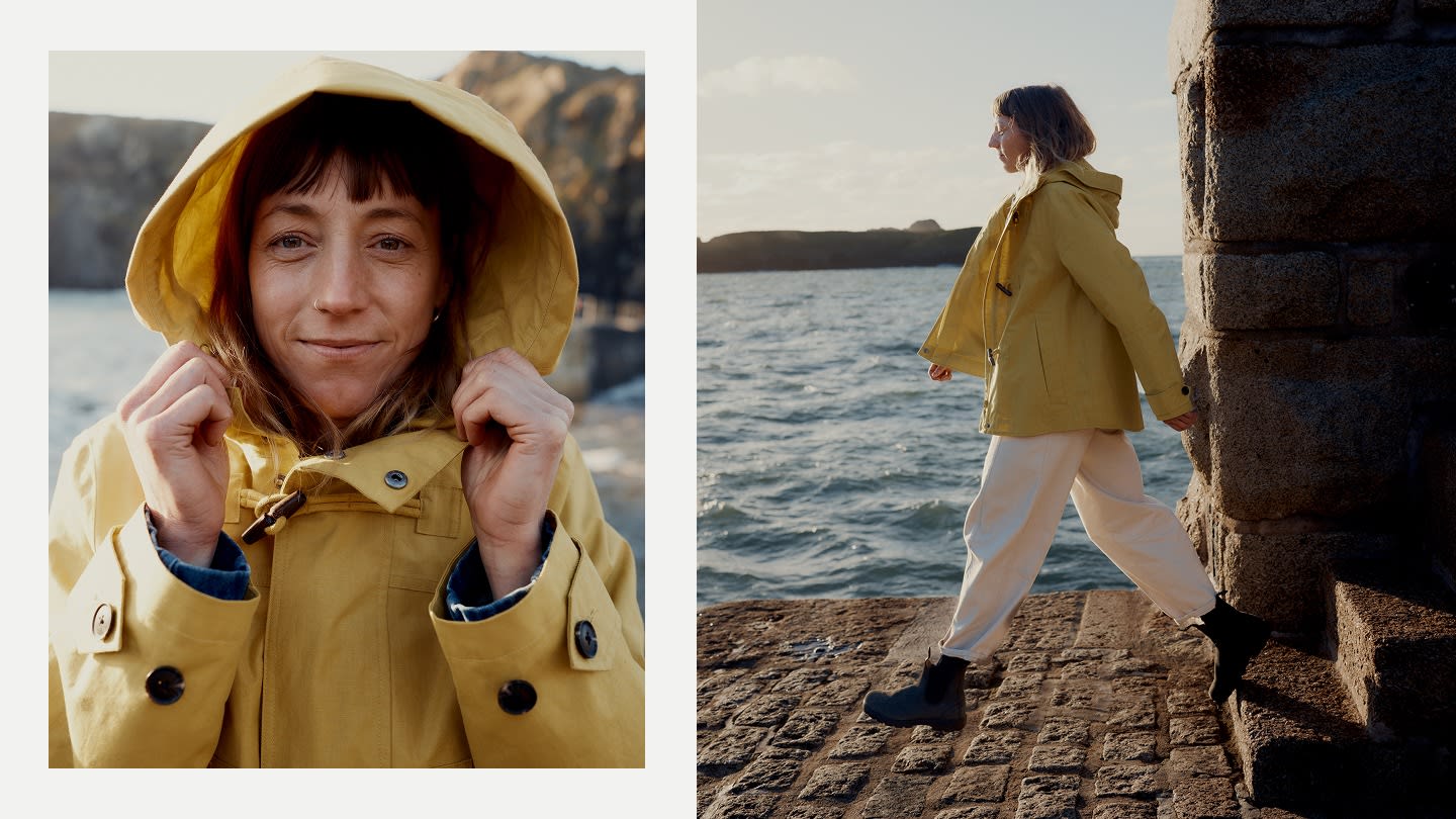 Two images of Fiona Curtis wearing the yellow Sea Drift Coat and white trousers on a Cornish harbour.