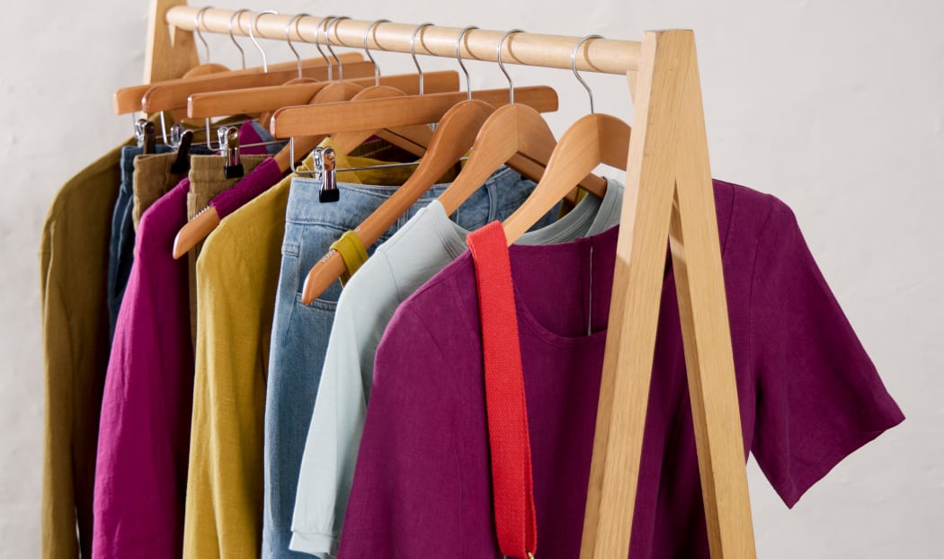 A rail of clothes from Seasalt's spring collection A rail of clothes from Seasalt's spring collection in a range of dynamic pinks, yellows and reds