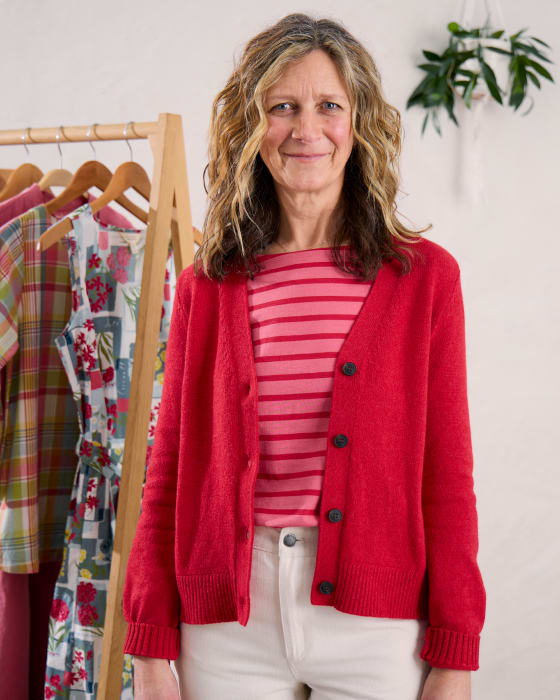 Laura Watson styling Seasalt's spring collection Laura Watson, Seasalt's Chief Creative Officer, styling a red cardigan and pink striped top from Seasalt's spring collection