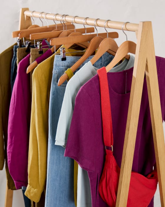 A rail of clothes from Seasalt's spring collection A rail of clothes from Seasalt's spring collection in a range of dynamic pinks, yellows and reds