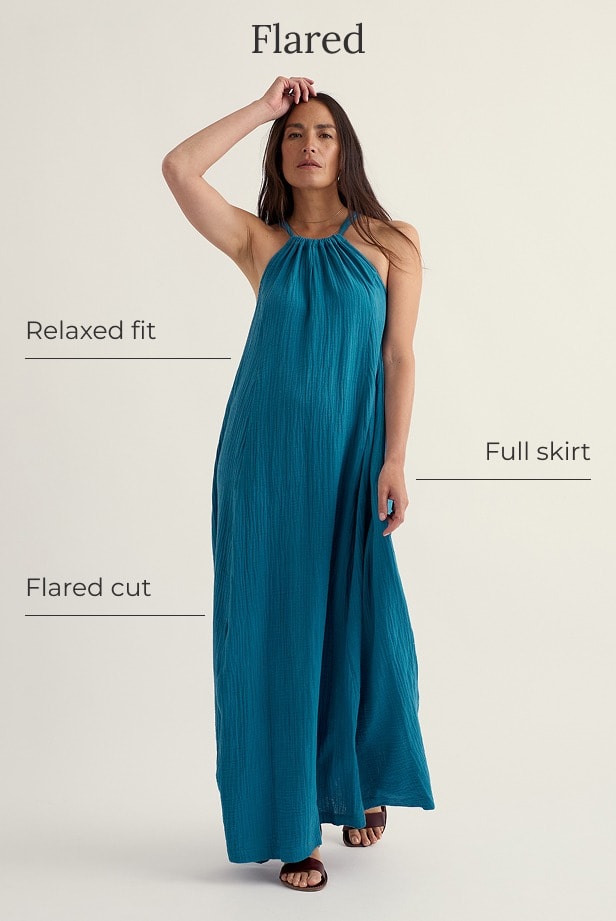 A model wears a blue long maxi dress with a flared silhouette