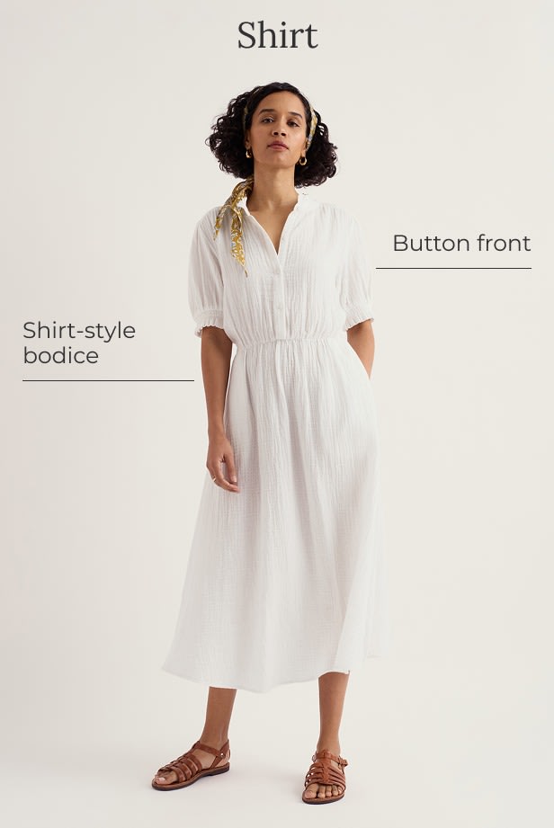 A model wears a white shirt dress with a yellow hair scarf