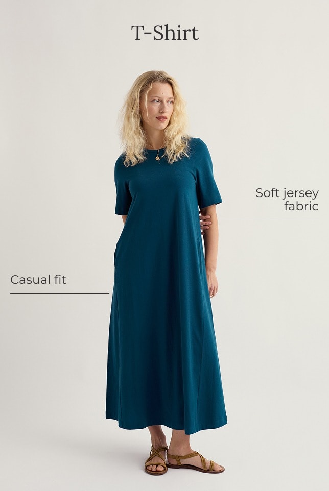 A model wears a maxi length navy blue t-shirt dress 