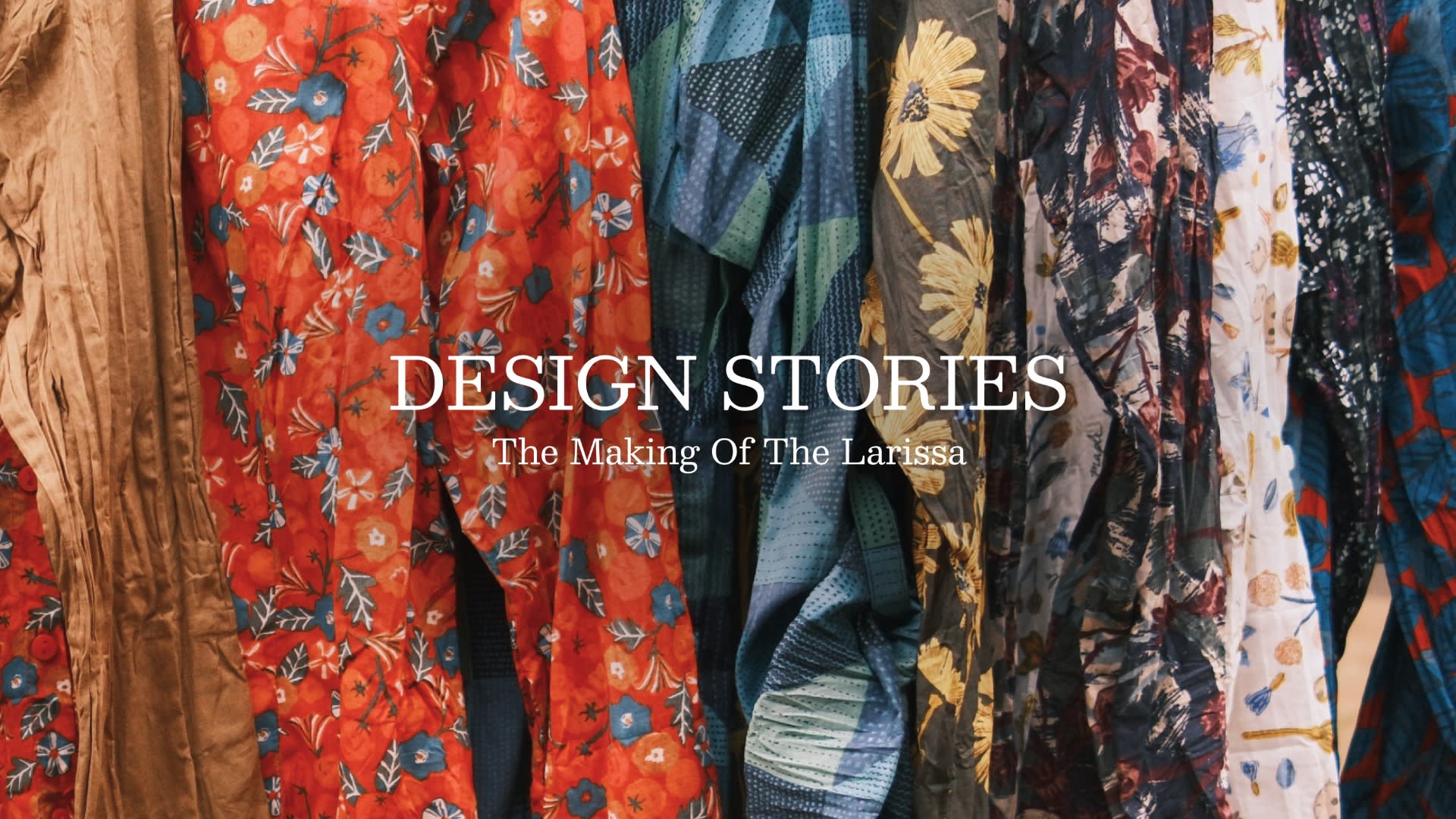 A row of colourful Larissa shirts are hung up on a rail. Text over the top of the image reads: Design Stories, The Making of a Larissa