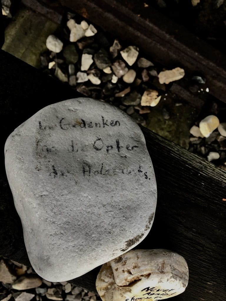 auschwitz 12 original train stop car with writing on memorial rock iax4gt