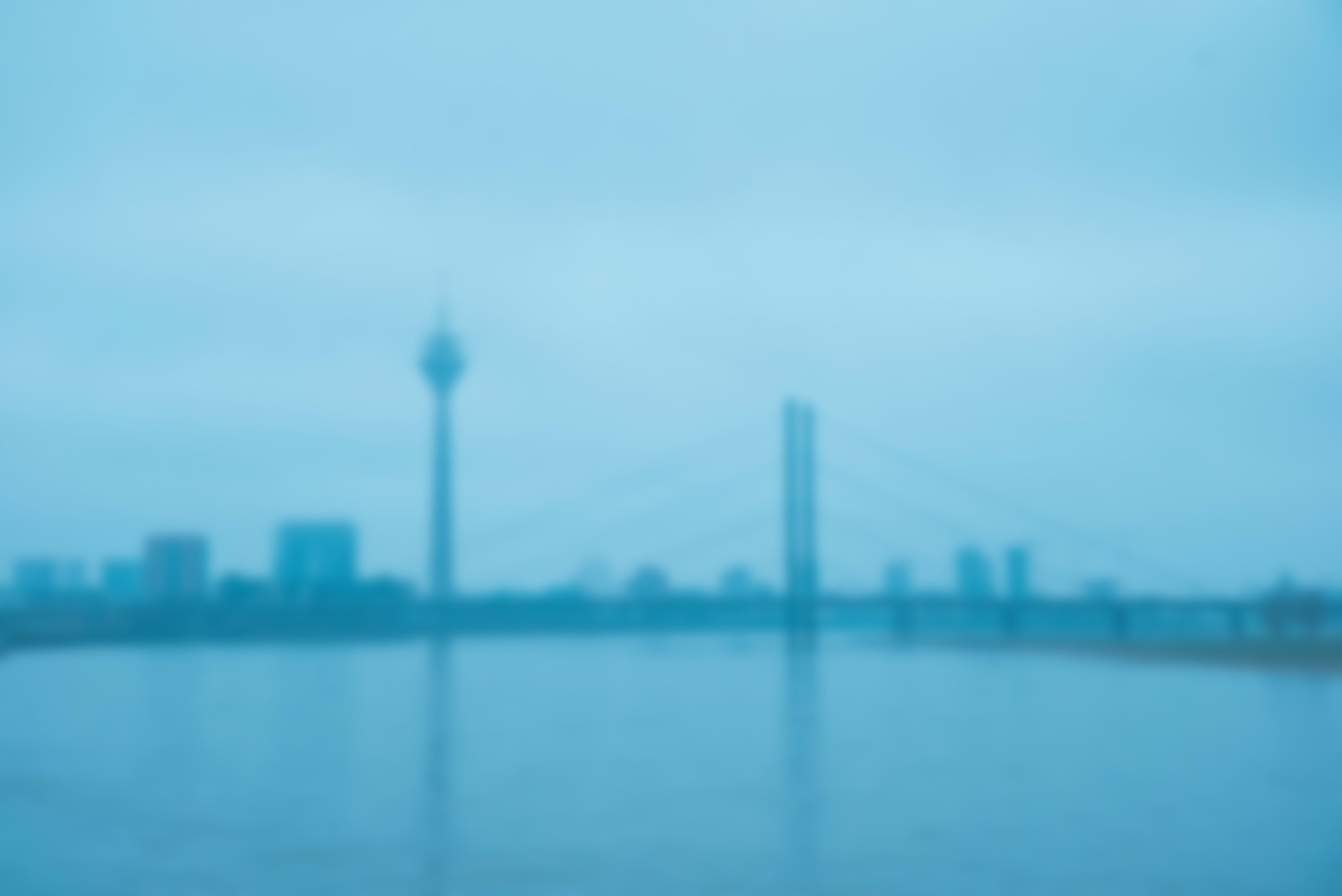 A large body of water with the city of Düsseldorf in the background.