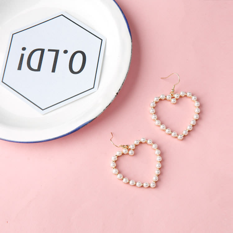 Cute peach heart pierced pearl earrings view 1