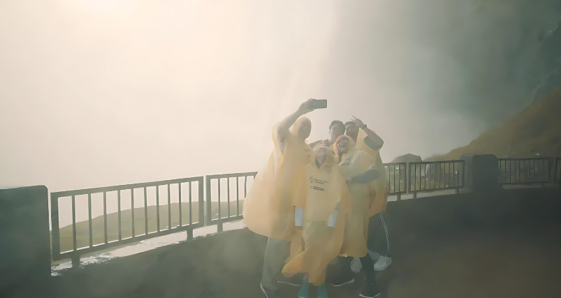 Guests taking selfie at Journey Behind the Falls