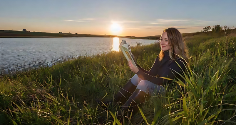 girl sitting at Lake of Shining Waters