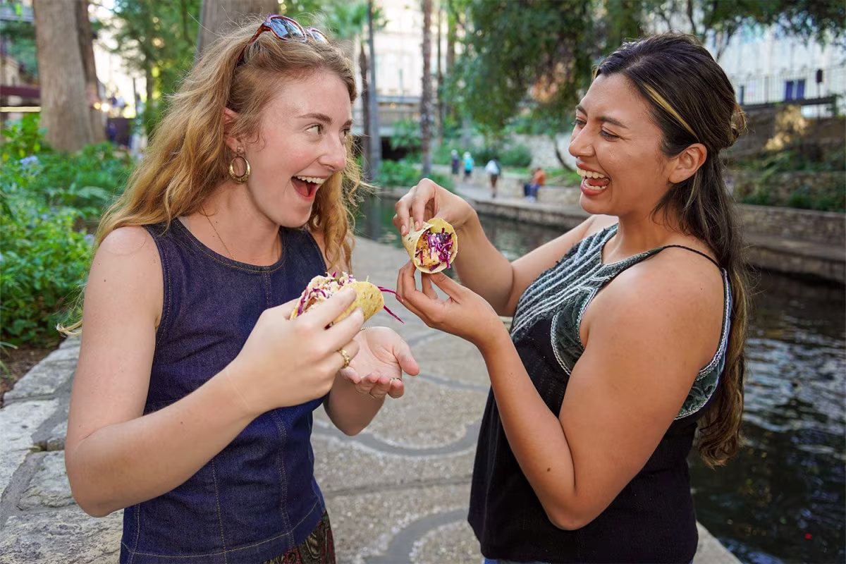 Friends Enjoying Tacos on Food Walking Tour