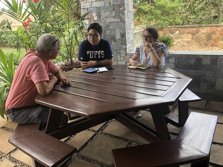 Carl Wilkens, one of the trip leaders and founder of World Outside My Shoes, meets with students during the 2018 SEGL in Rwanda trip.